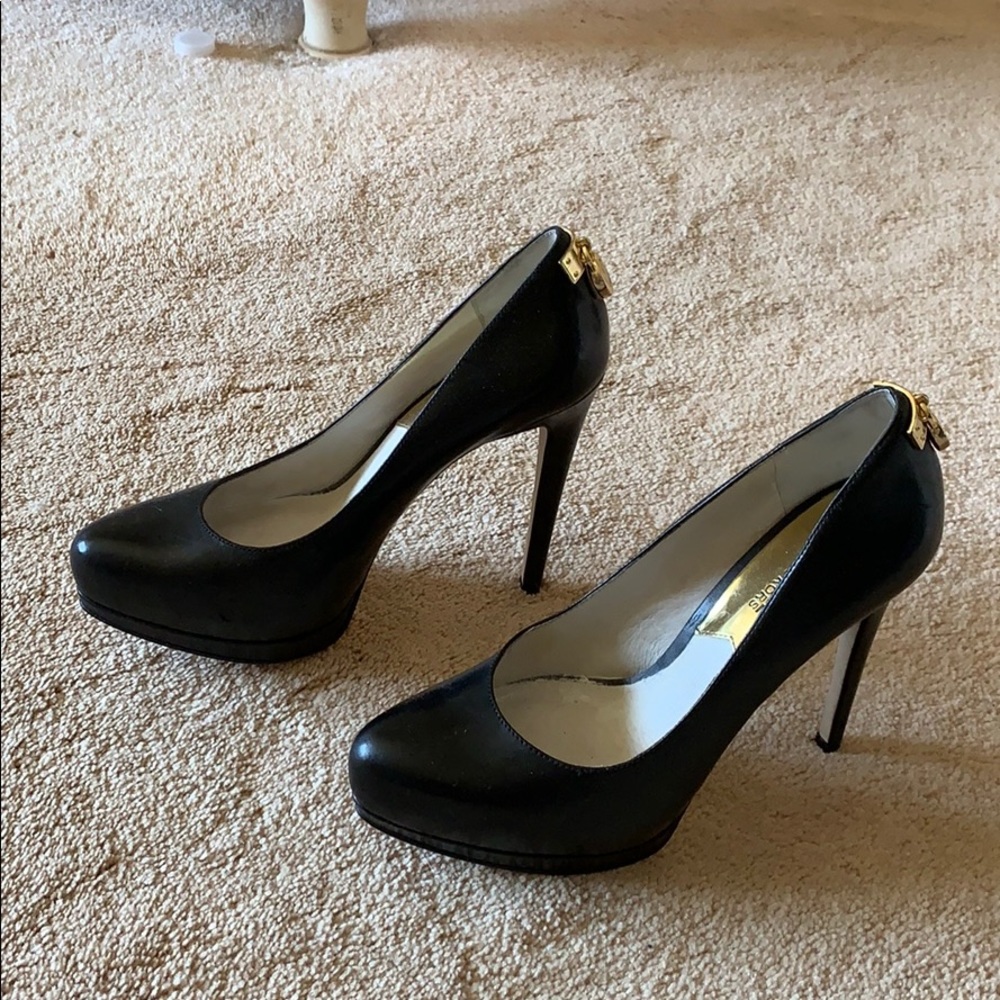 Black Michael Kors pumps with gold hardware detail
